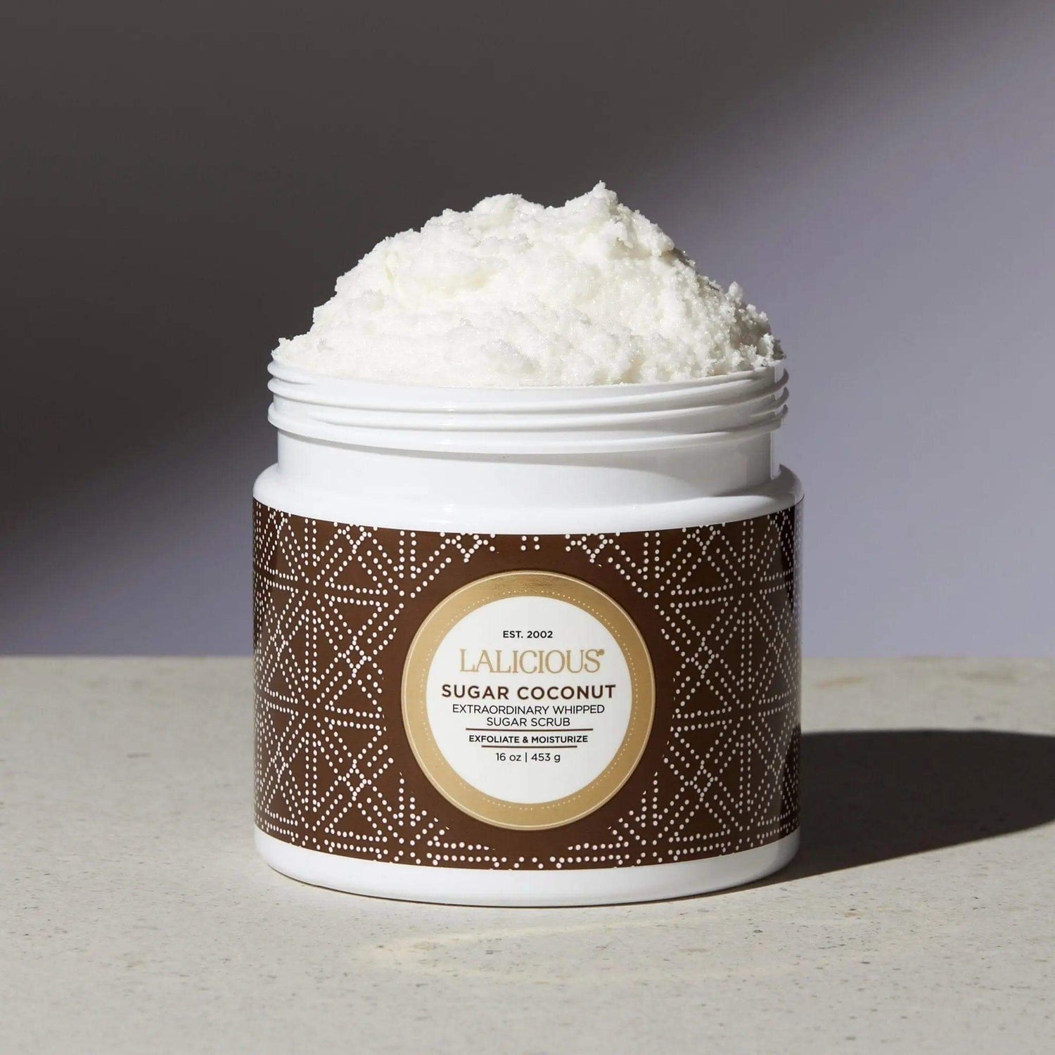 Sugar Coconut Sugar Scrub jar showcasing luxurious exfoliating and hydrating body care with pure cane sugar.