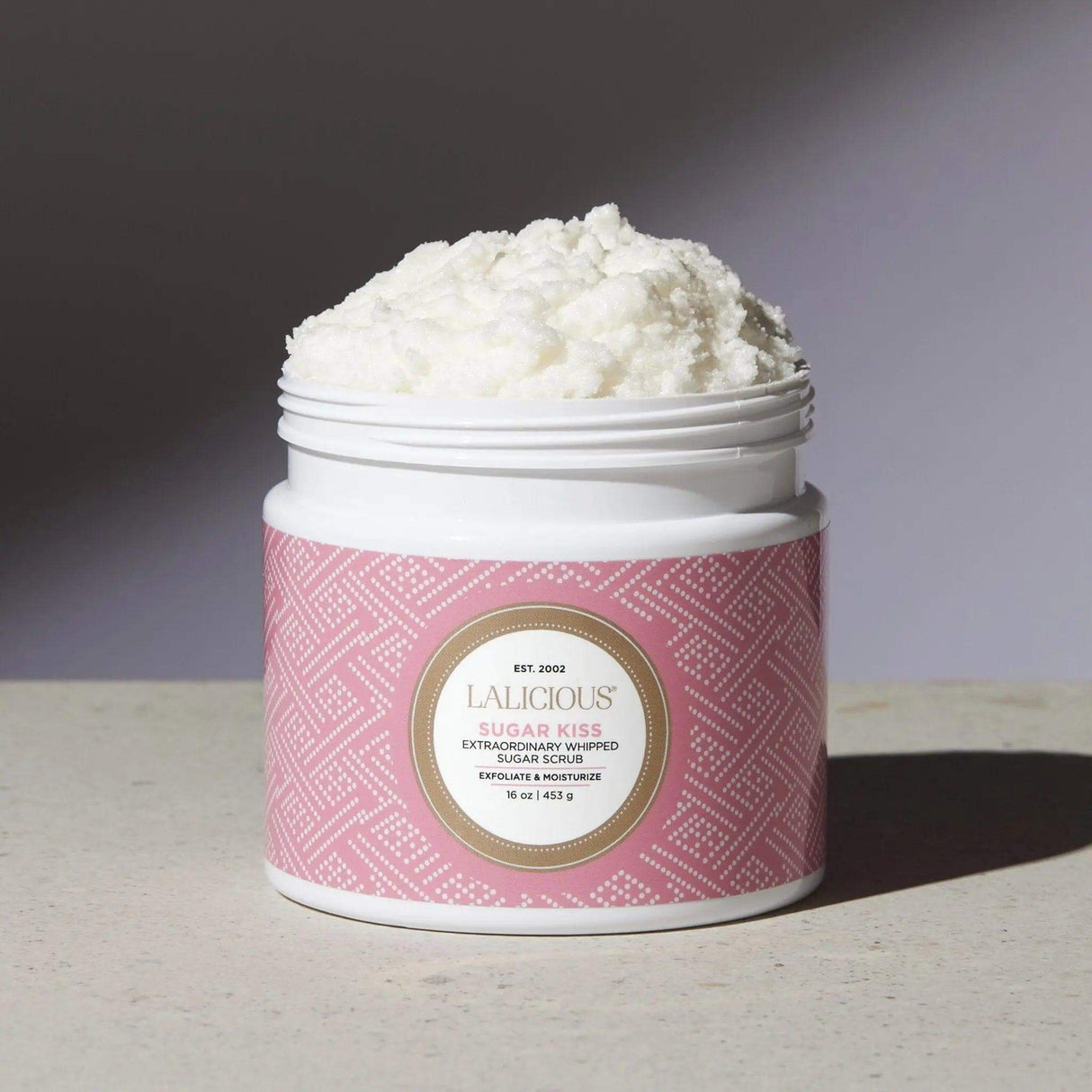 Open jar of Lalicious Sugar Kiss whipped sugar scrub for exfoliation and hydration