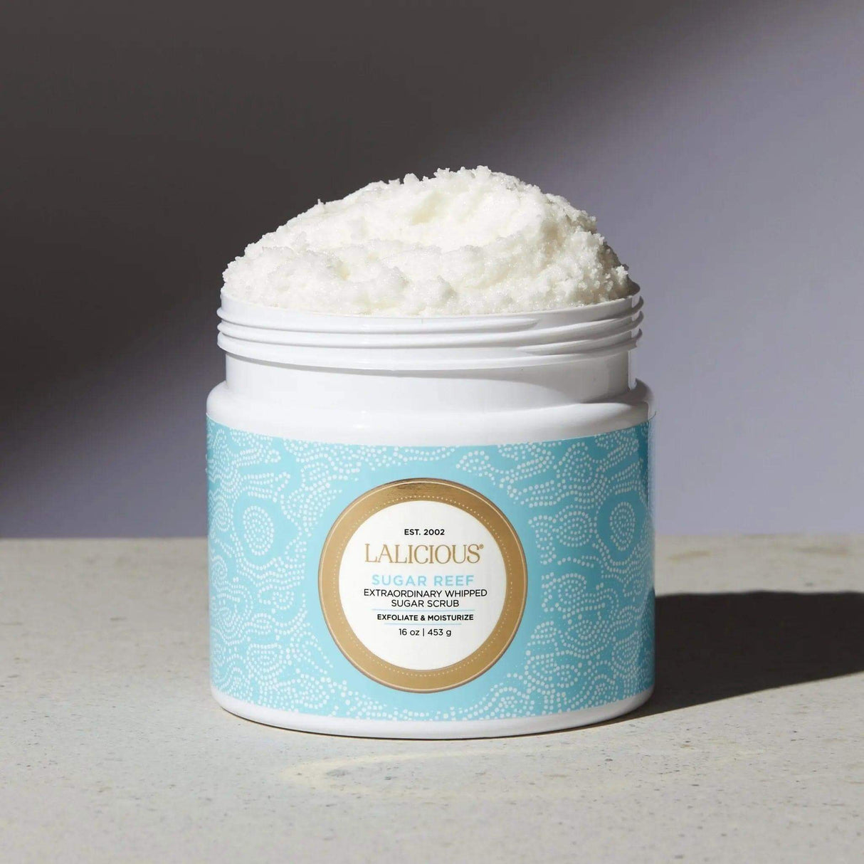 Sugar Reef Sugar Scrub in jar, top luxury exfoliating and hydrating body care product with pure cane sugar, coconut oil, almond.