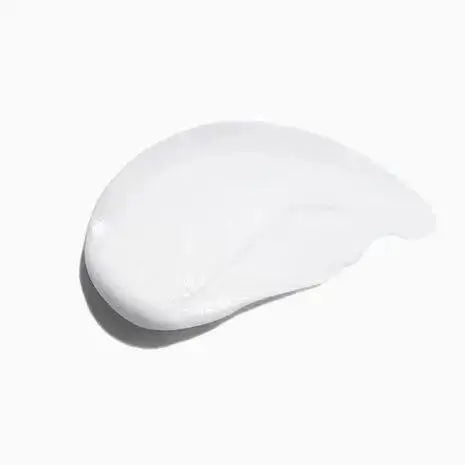 Creamy texture of Symbiose Fondant Apaisant Essentiel conditioner for hydrating and calming sensitive scalps.