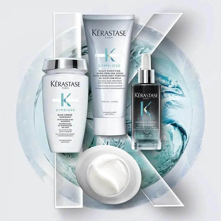 Kerastase Symbiose hair care range includes shampoo, conditioner, and overnight serum displayed on a decorative background.