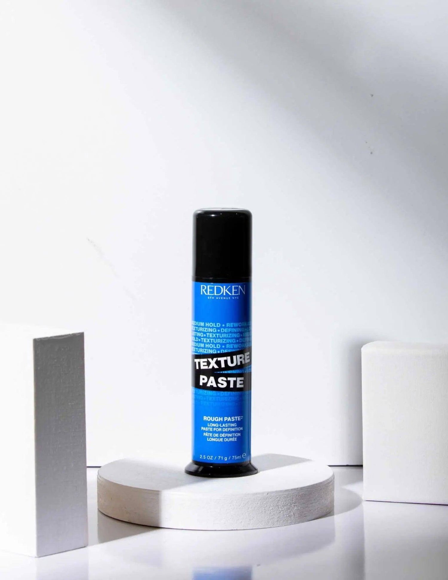 Redken Texture Paste styling product for all hair types, enhances texture and definition with flexible hold.
