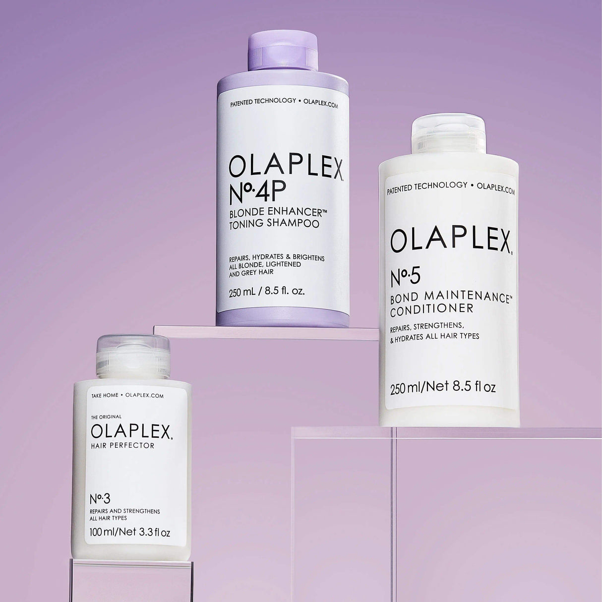 Olaplex Blonde Maintenance System with Nº.3 Hair Perfector, Nº.4P Purple Shampoo, and Nº.5 Conditioner for blonde and grey hair care.