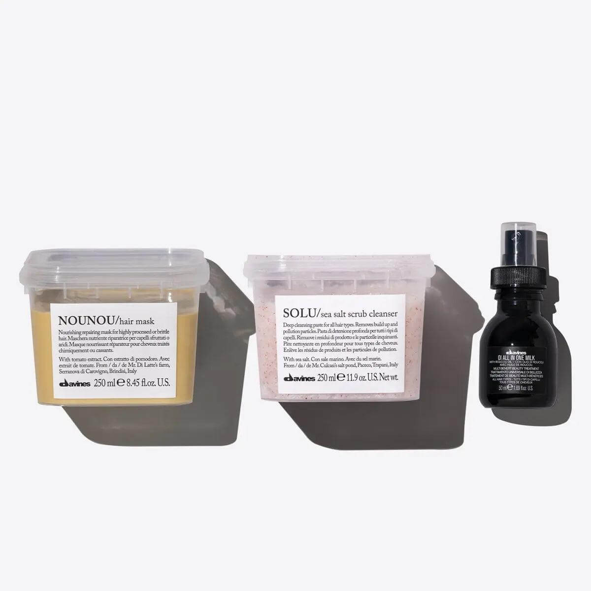 The Clean Slate Set with Nounou Hair Mask, Solu Sea Salt Scrub, and OI All In One Milk for ultimate hair care.