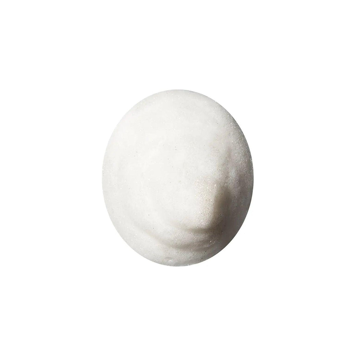 Close-up of The Cleanse Clarifying Shampoo foam, showcasing its detoxifying volcanic ash formula for all hair types.