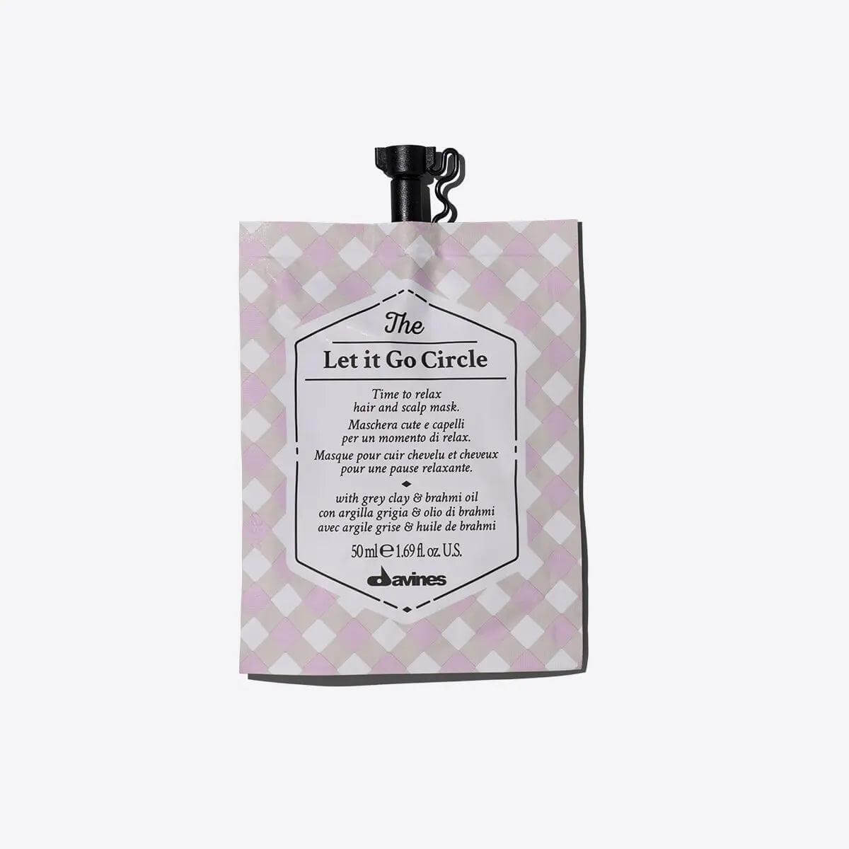 Packaging of 'The Let It Go Circle' hydrating and softening hair and scalp mask, offering a soothing wellness experience.