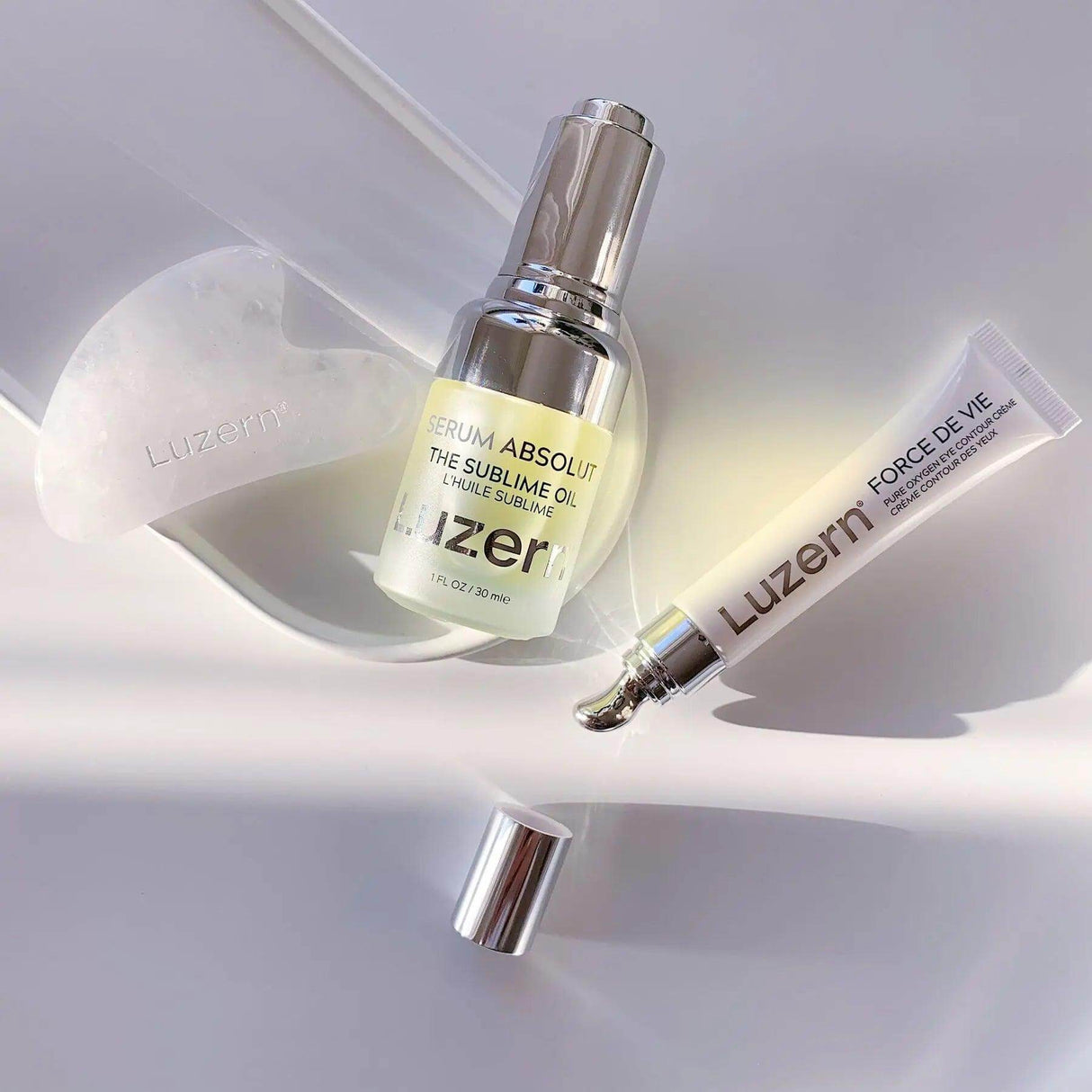 Luzern The Sublime Oil skincare bottle and Force De Vie serum tube enhancing skin hydration and reducing fine lines.