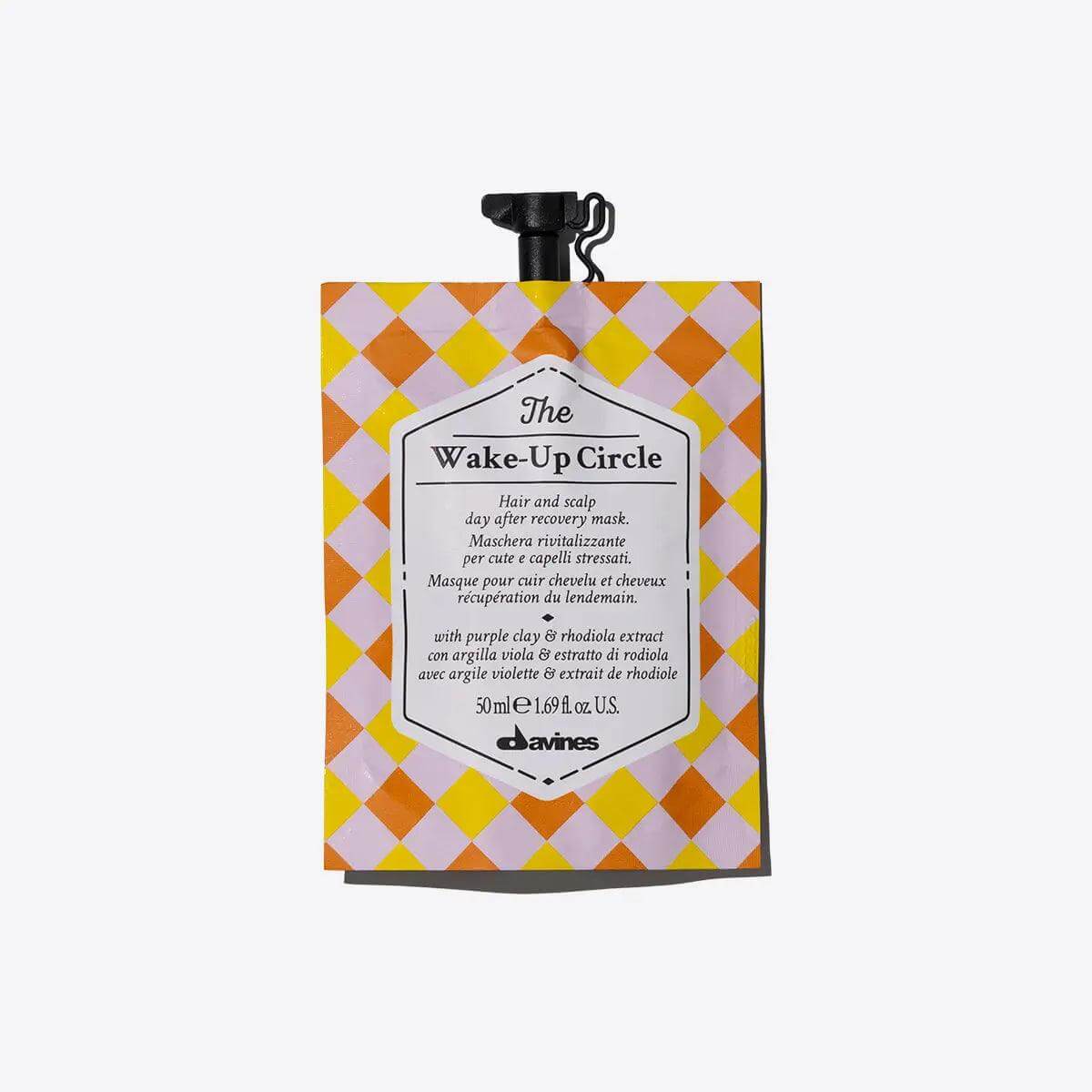 The Wake-Up Circle revitalizing mask for stressed hair, 50 ml sachet, orange and yellow checkered packaging by Davines