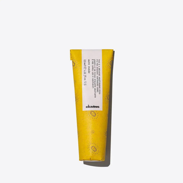 Relaxing Moisturizing Fluid in yellow tube, hydrates hair, reduces frizz, enhances shine, protects against heat and humidity