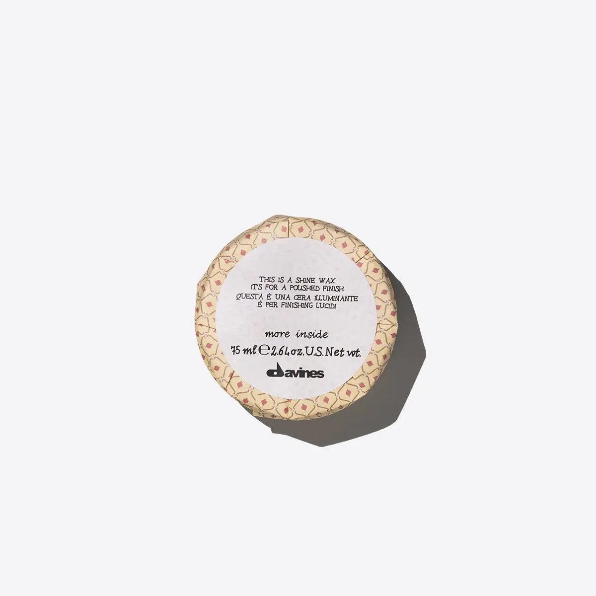 Shine Wax jar for glossy and sleek hair styles, lightweight and non-sticky formula.