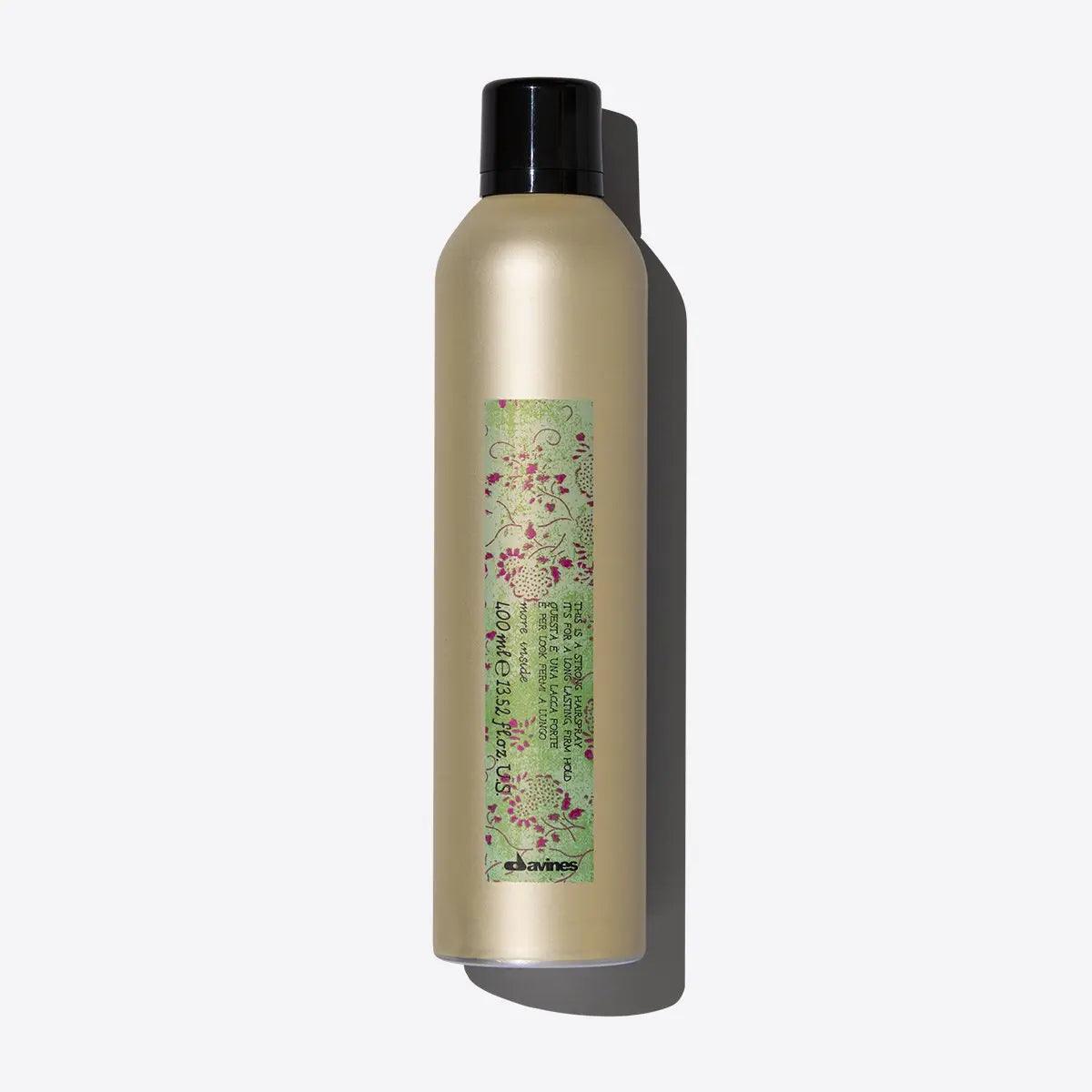 Bottle of invisible strong hold hairspray with humidity-resistant formula for easy styling.
