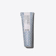 Tube of strong hold cream gel for defining short hairstyles with a wet look and frizz control, in patterned blue packaging.