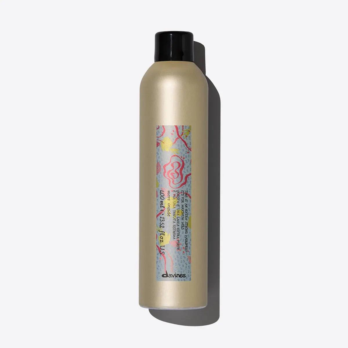 Extra Strong Hairspray bottle for long-lasting hold without stickiness, designed to resist humidity and keep hair styled all day.