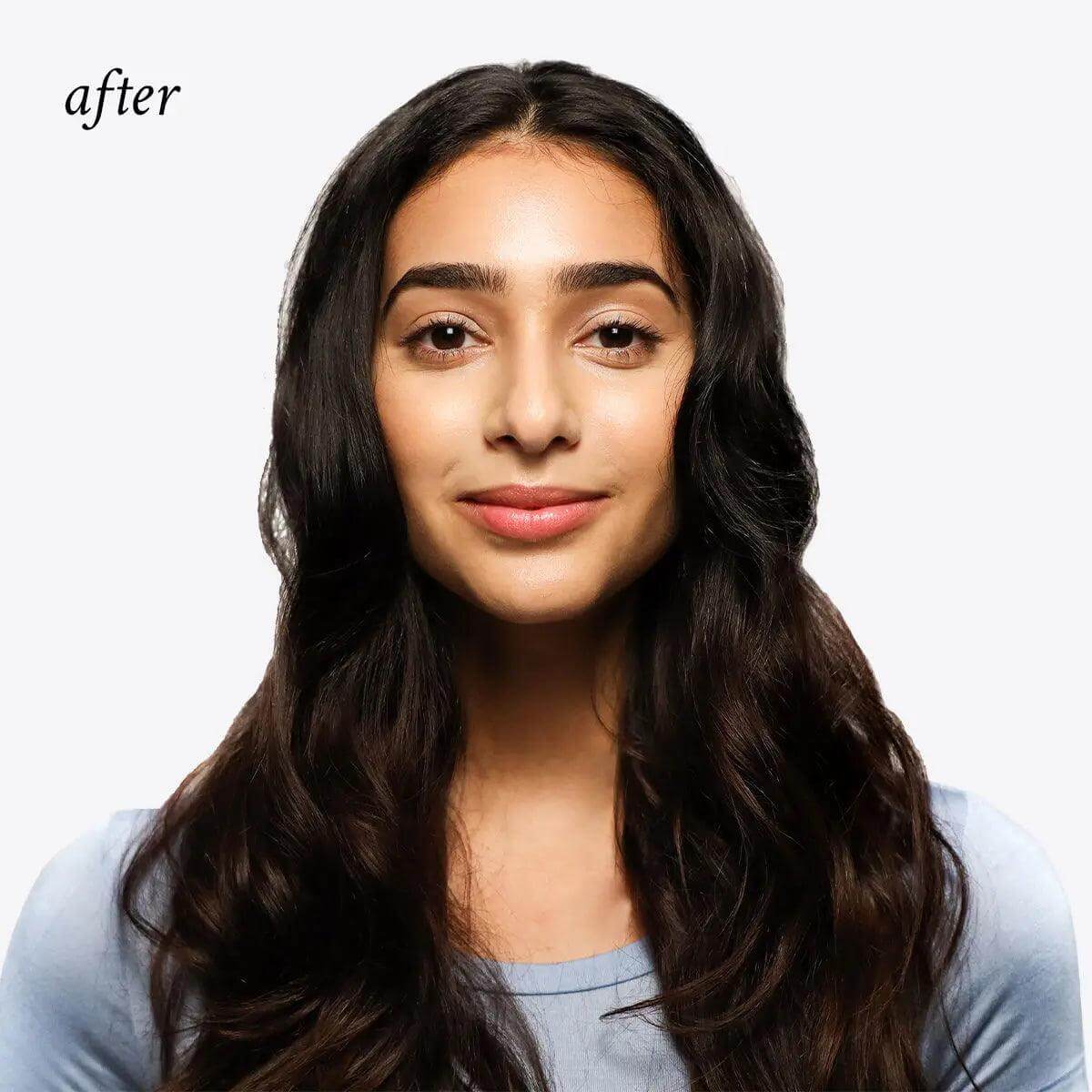 Woman with refreshed, volumized hair after using invisible dry shampoo