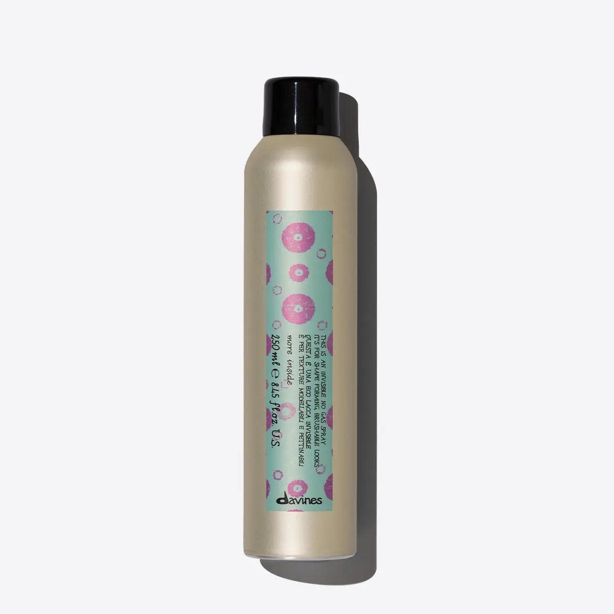 Non-aerosol hairspray bottle offering brushable hold and natural finish with humidity resistance.
