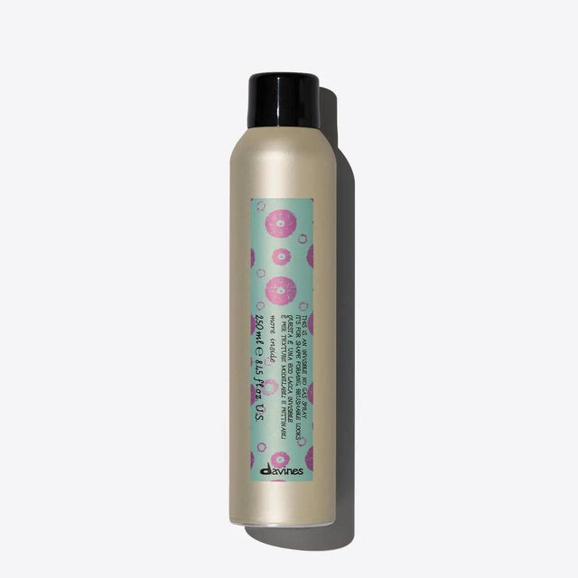 Non-aerosol hairspray bottle offering brushable hold and natural finish with humidity resistance.