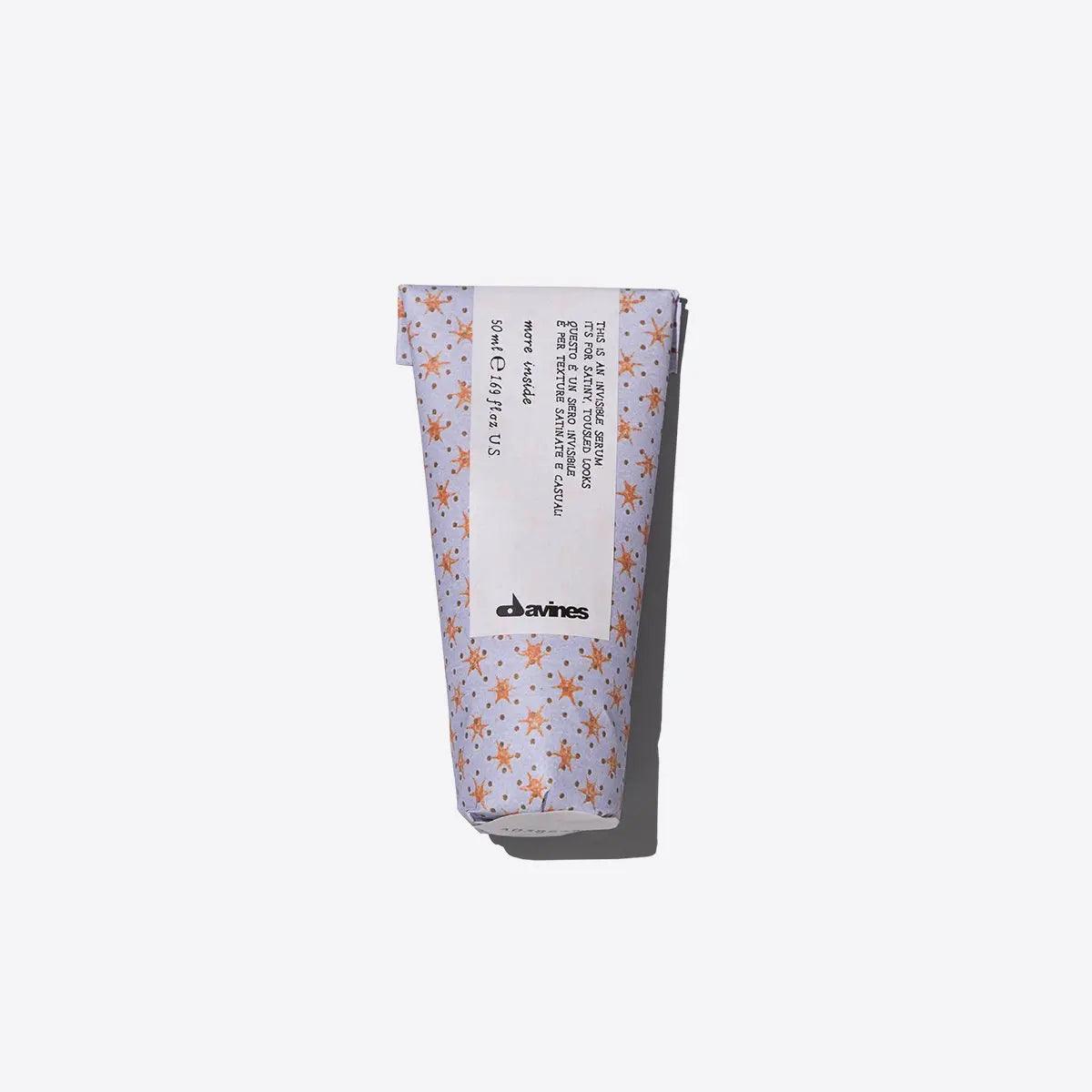 Davines Invisible Serum tube for frizz control and soft texture, offering a casual, tousled look ideal for everyday styling.