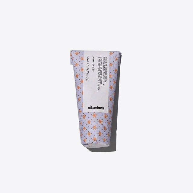 Davines Invisible Serum tube for frizz control and soft texture, offering a casual, tousled look ideal for everyday styling.