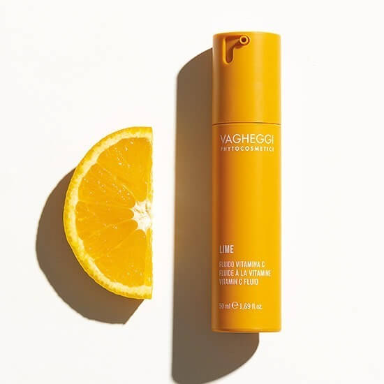 Lime Vitamin C Fluid bottle with sliced orange, rich in antioxidants, hydrates and revitalizes skin with vitamin C and natural oils, 50ml