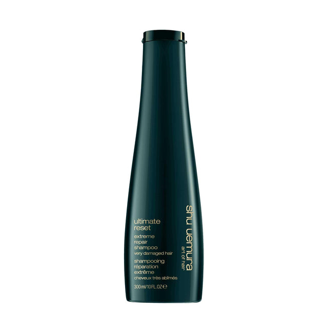 Shu Uemura Ultimate Reset Shampoo for severely damaged hair in a sleek bottle, ideal for all hair textures and chemical treatments.