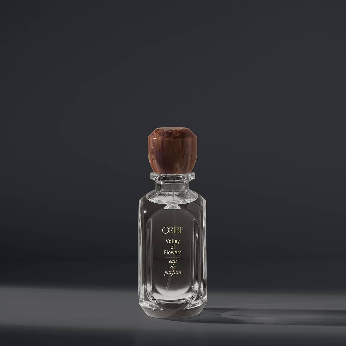 Elegant bottle of Valley Of Flowers Eau De Parfum with notes of rose, jasmine, amber, and musk. Perfect fragrance for a floral escape.