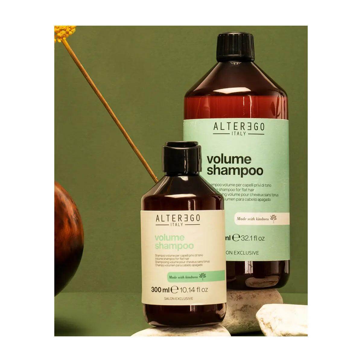 Two bottles of Alter Ego Italy Volume Shampoo for fine hair, infused with cotton and bamboo oil, displayed on a natural background.