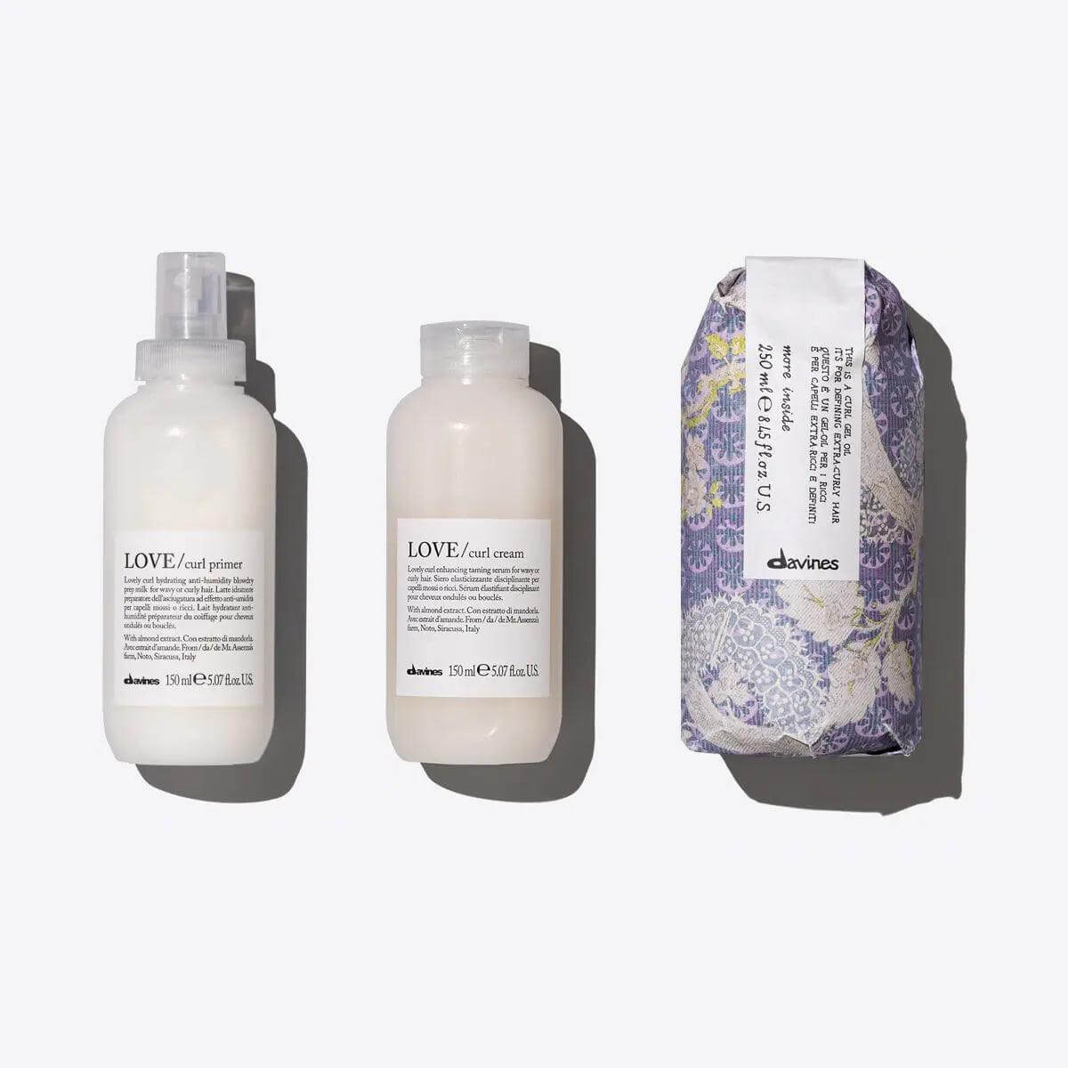 Voluminous Curls Set with LOVE CURL Primer, Cream, and Gel Oil for natural volume and frizz control.
