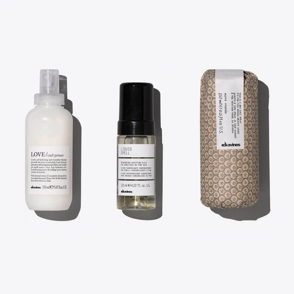 Voluminous Waves Set: LOVE CURL Primer, Liquid Spell, and styling product for defined, voluminous wavy hair care.
