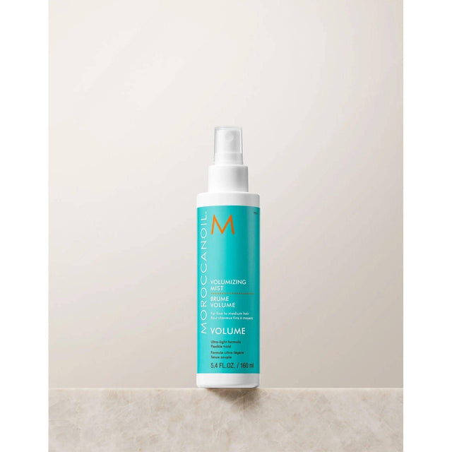 Volumizing Mist bottle for fine hair, boosts volume with argan oil and Dead Sea Salt, creating fuller, bouncy texture.