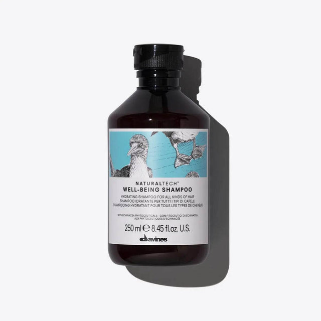 Bottle of Wellbeing Shampoo for all hair types, offering moisturizing and protective benefits, suitable for gentle daily cleansing.
