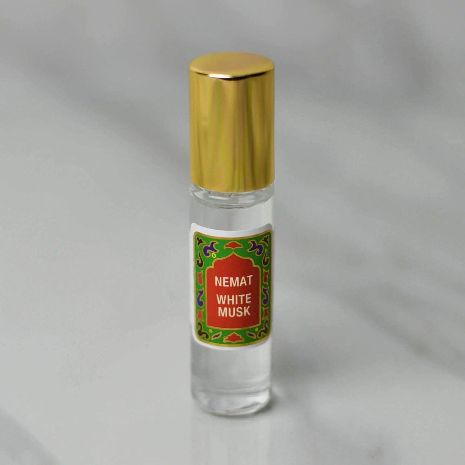 White Musk Roll-On Perfume, 10 ml bottle with gold cap, features a gentle, warm scent in premium quality applicator for on-the-go use.