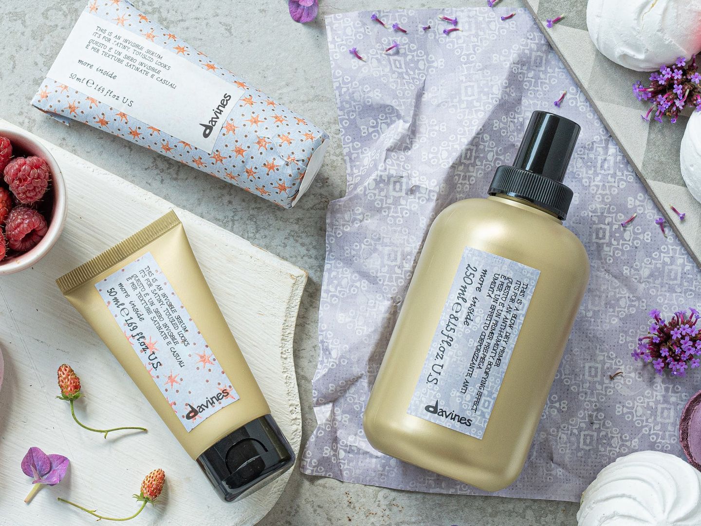 Cosmetic products, packaging, natural ingredients, lavender, light stone background.
