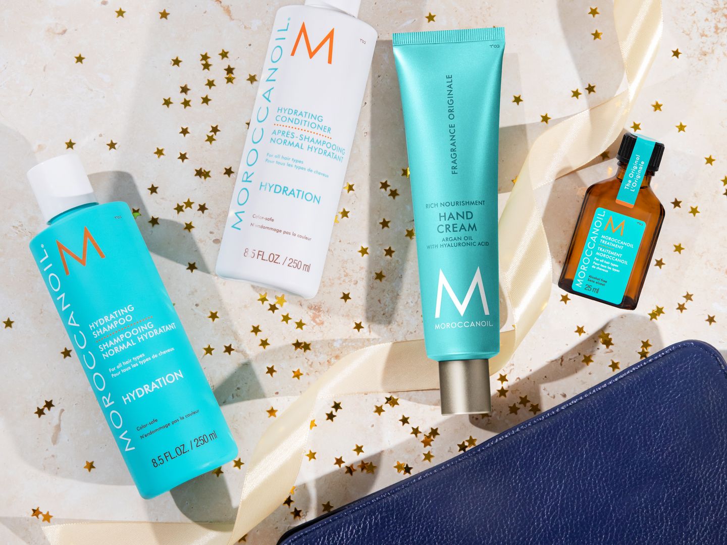 Beauty products arranged artistically with decorative stars and ribbon.