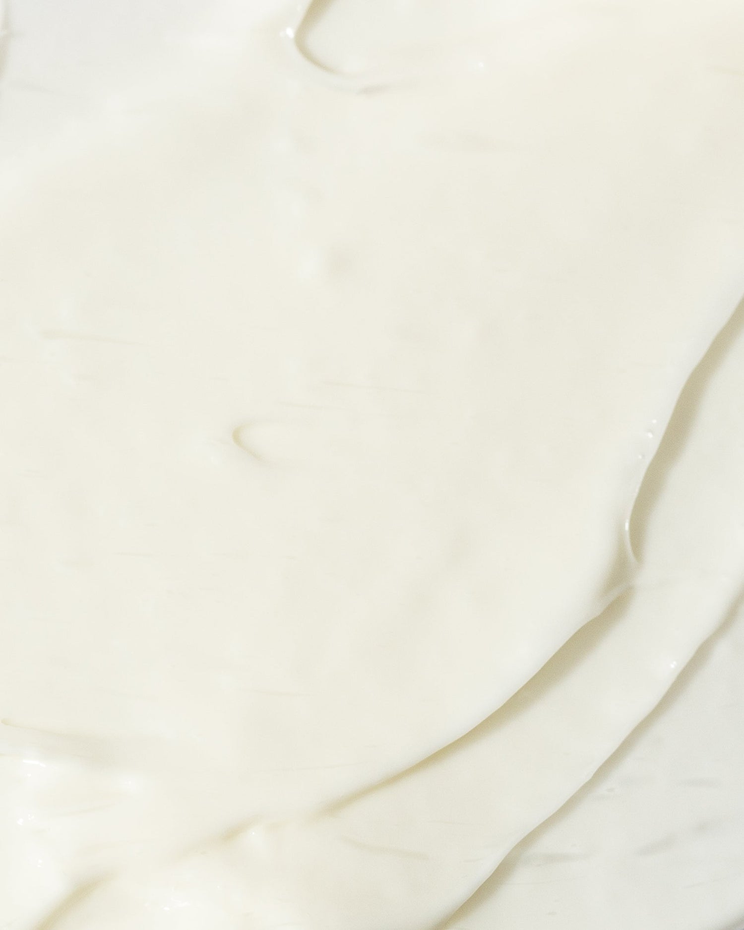 Smooth texture of age-defying moisturizer cream, enriched with Vitamins C and E, hyaluronic acid, and peptides for nourishing skin.