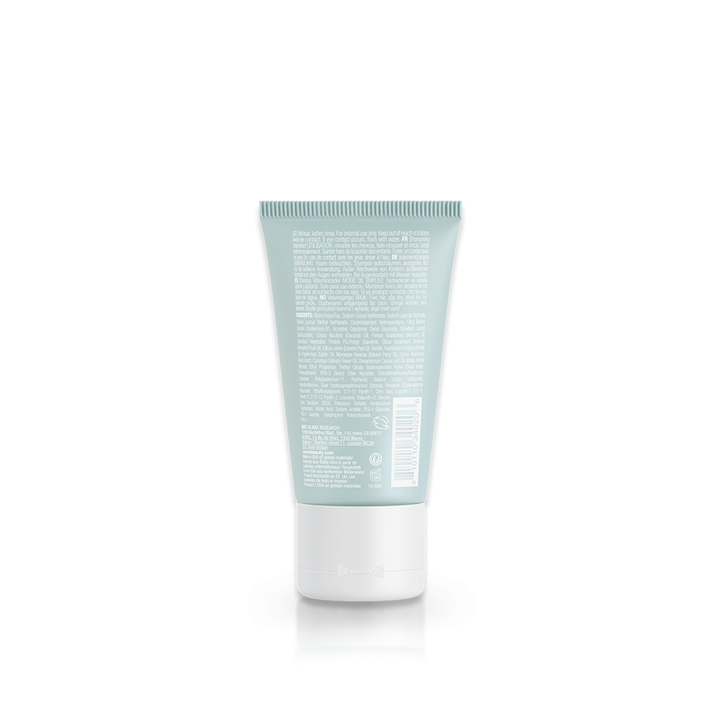 Back view of Neu Volume Shampoo bottle showcasing product details and label.