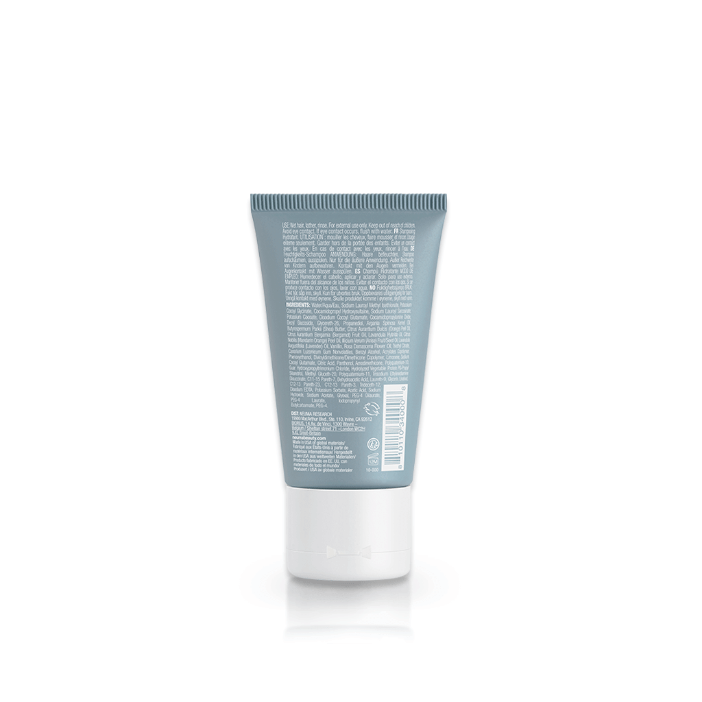 Back view of Neu Moisture Shampoo bottle, highlighting product info and ingredients. Ideal for smooth, shiny, and hydrated hair care.