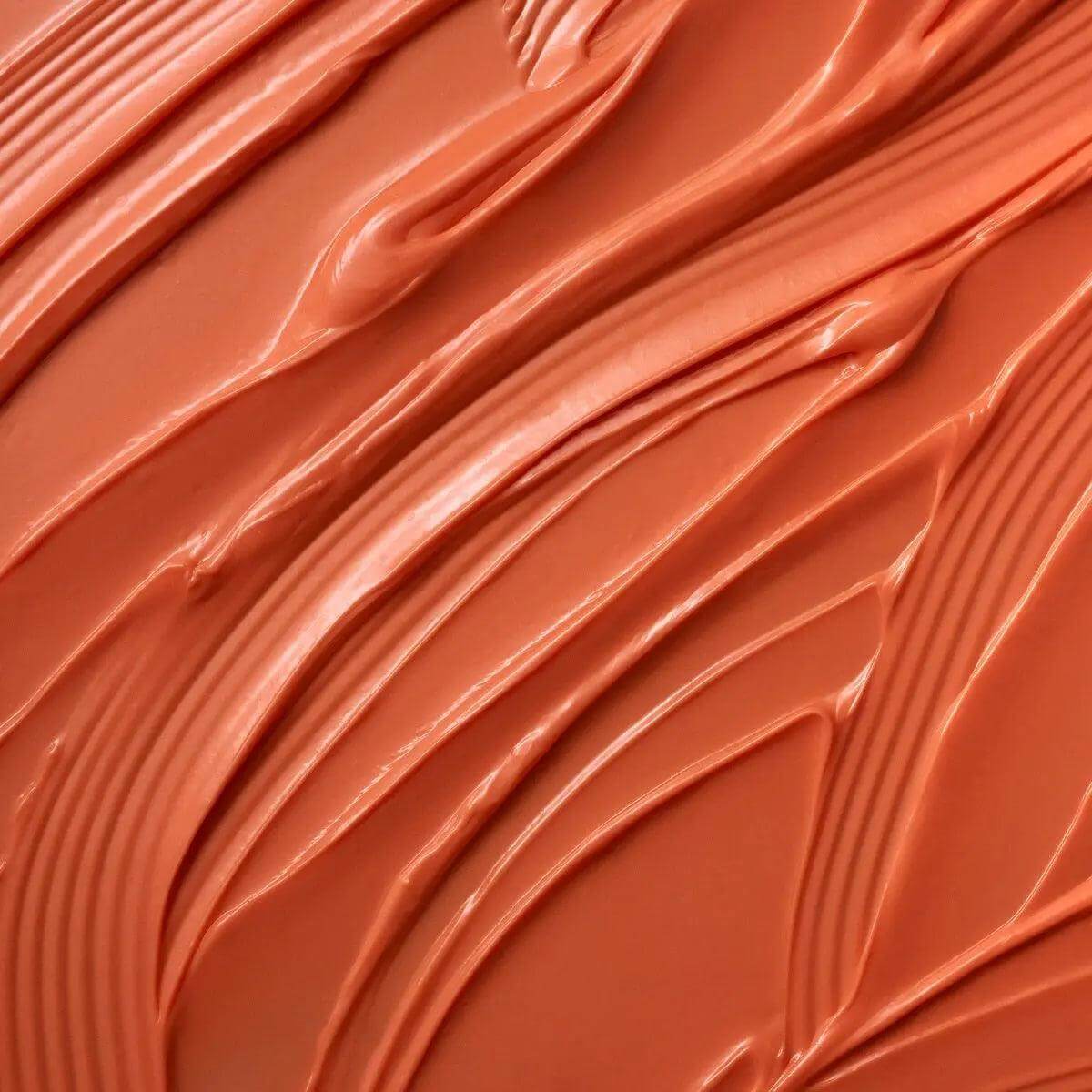 Moroccanoil Color Depositing Mask texture in rich terracotta hue, highlighting rejuvenating and conditioning properties.