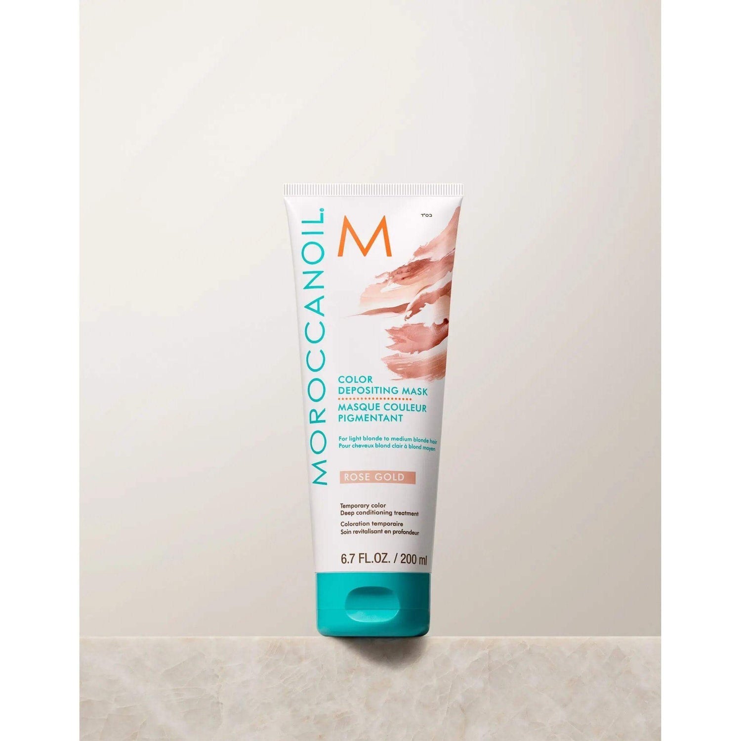 Moroccanoil Color Depositing Mask in Rose Gold, 6.7 fl oz, enhances tone, refreshes color, deep conditions, and adds shine.