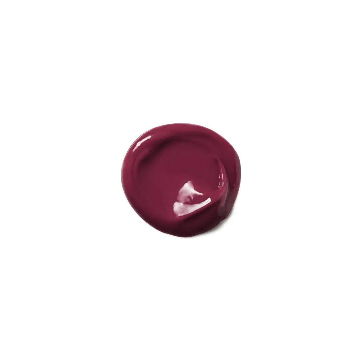 Rich plum color of Moroccanoil Color Depositing Mask swatch, enhances tones and deep conditions hair for radiant shine.