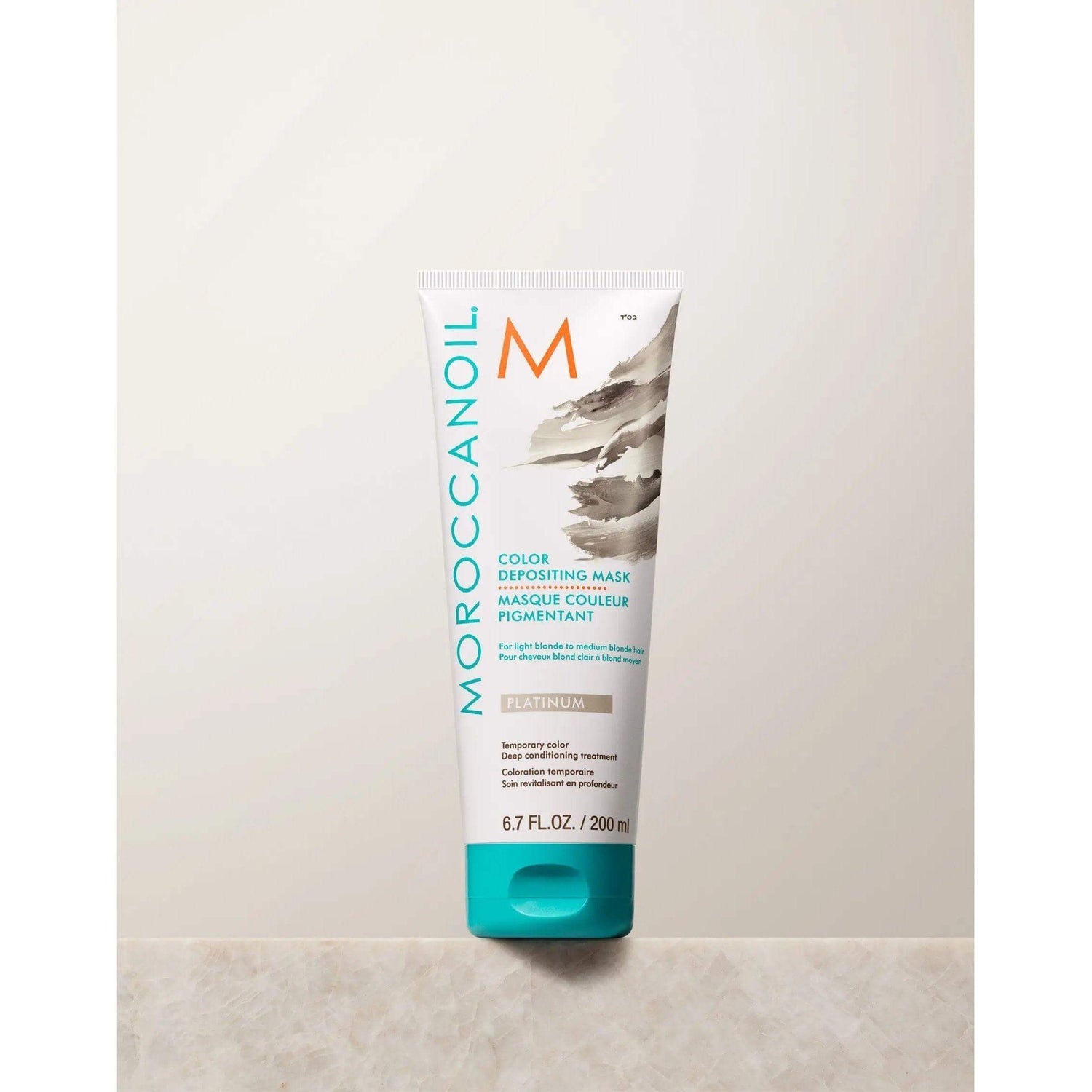 Moroccanoil Color Depositing Mask tube for hair conditioning and color rejuvenation, 200ml. Enhances tone and adds radiant shine.