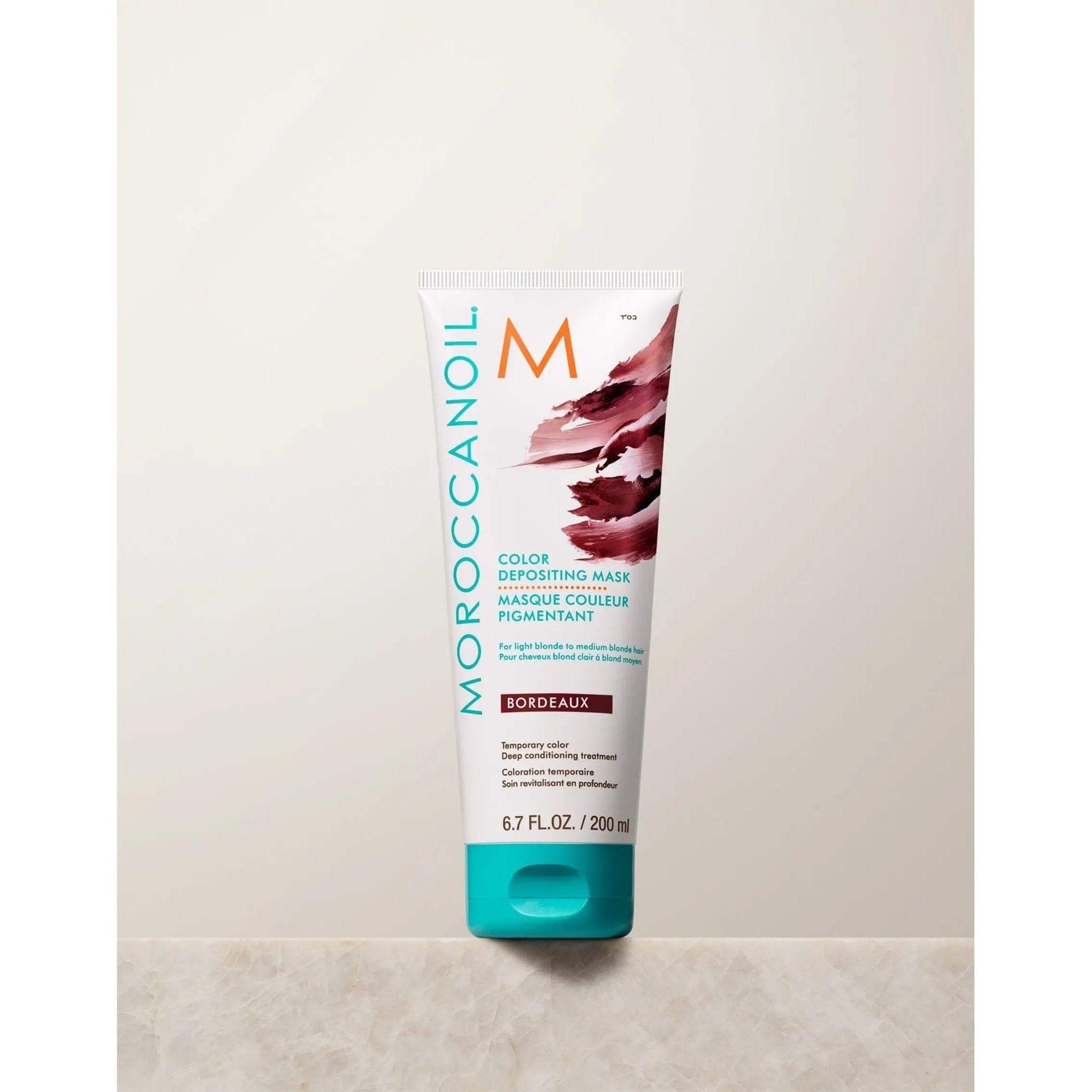 Moroccanoil Color Depositing Mask in Bordeaux, rejuvenates hair color, deep conditions, boosts shine and softness.