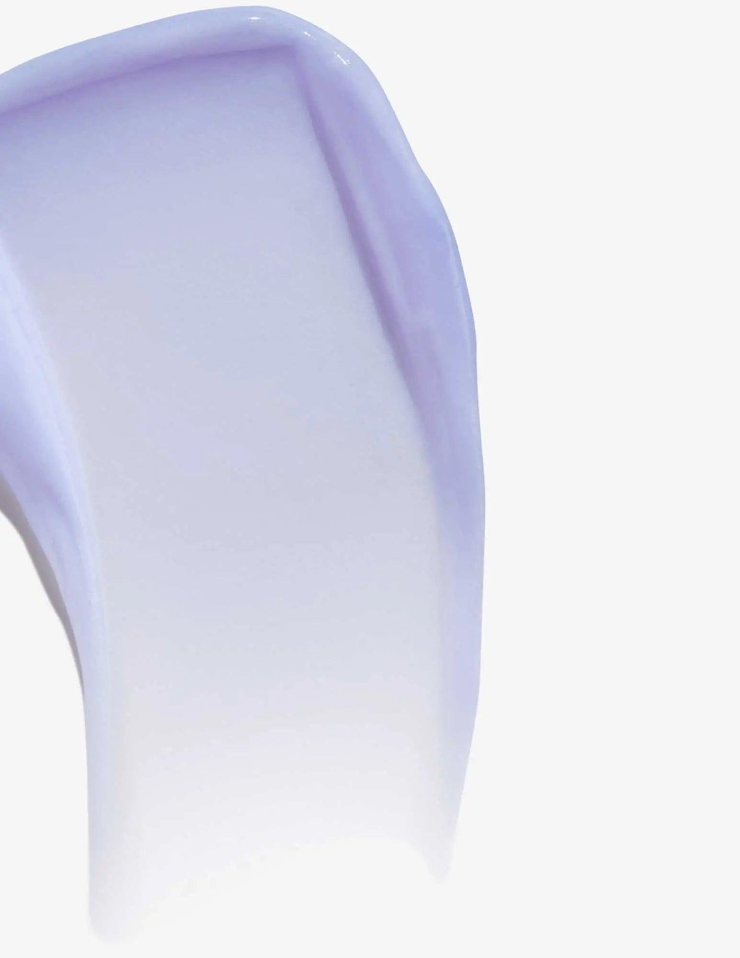 Close-up of Redken Color Extend Blondage Conditioner showing its creamy purple texture for blonde hair care.