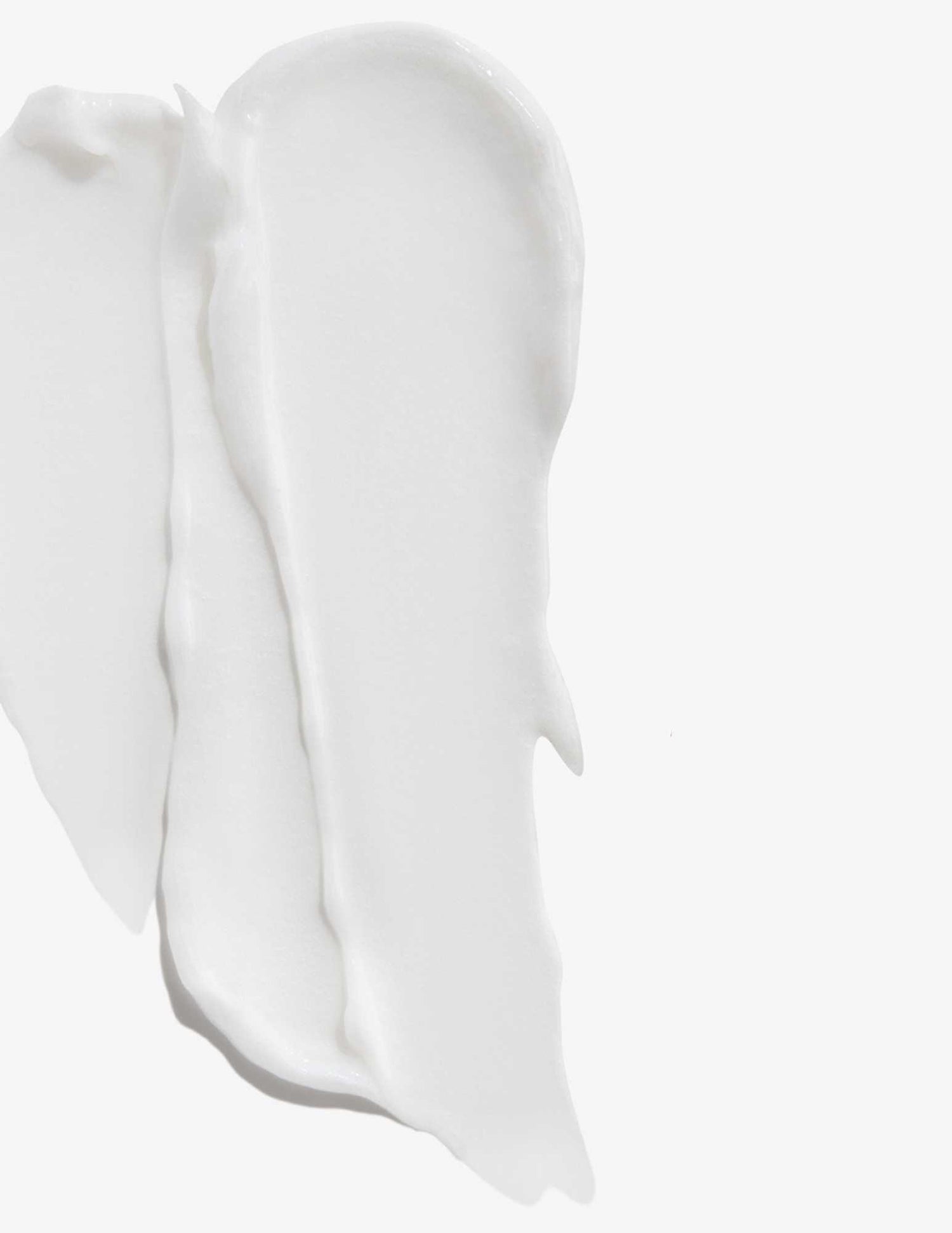 Close-up of Redken Color Extend Conditioner texture, highlighting its creamy and nourishing formula for color-treated hair.