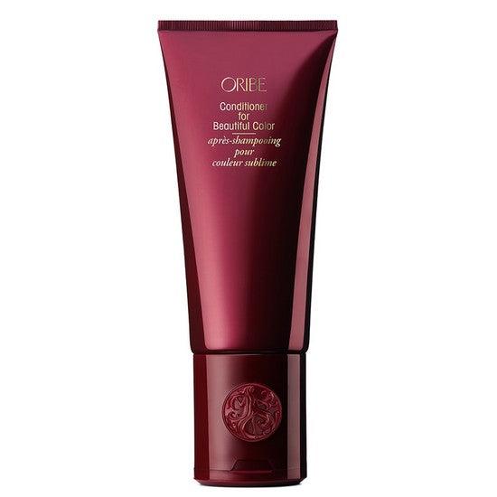 Luxury conditioner for vibrant, protected color-treated hair, shields against UV damage, featuring Oribe Beautiful Color packaging.