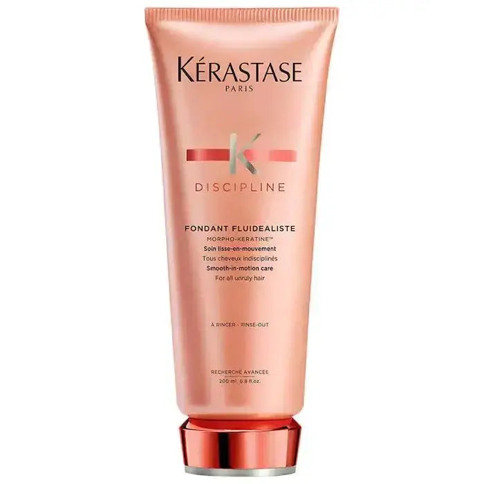 Kerastase Fondant Fluidéaliste Conditioner for frizzy hair in a pink tube, controls frizz and enhances manageability.