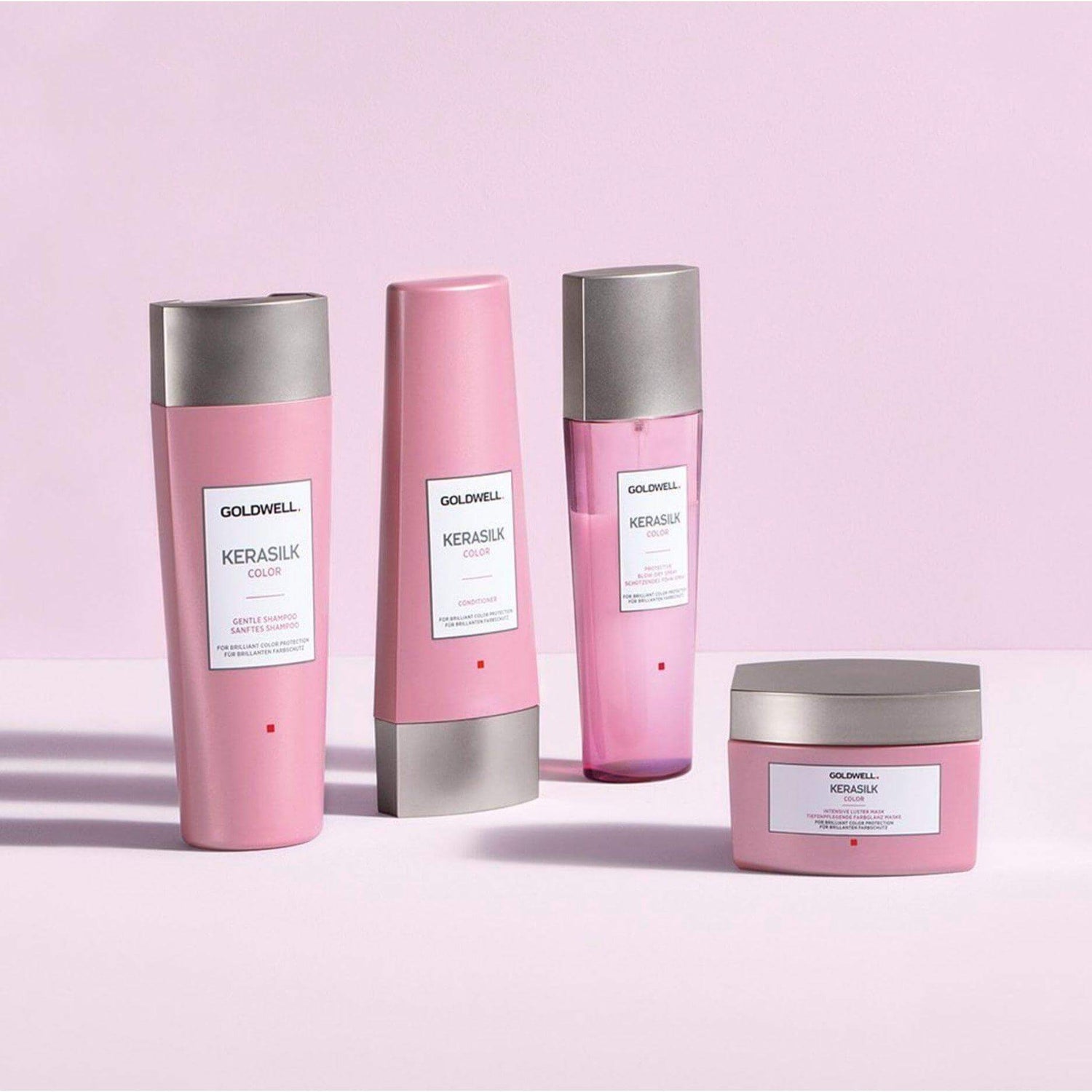 Goldwell Kerasilk Color haircare products on a light pink background, ideal for nourishing and managing dry, damaged hair.