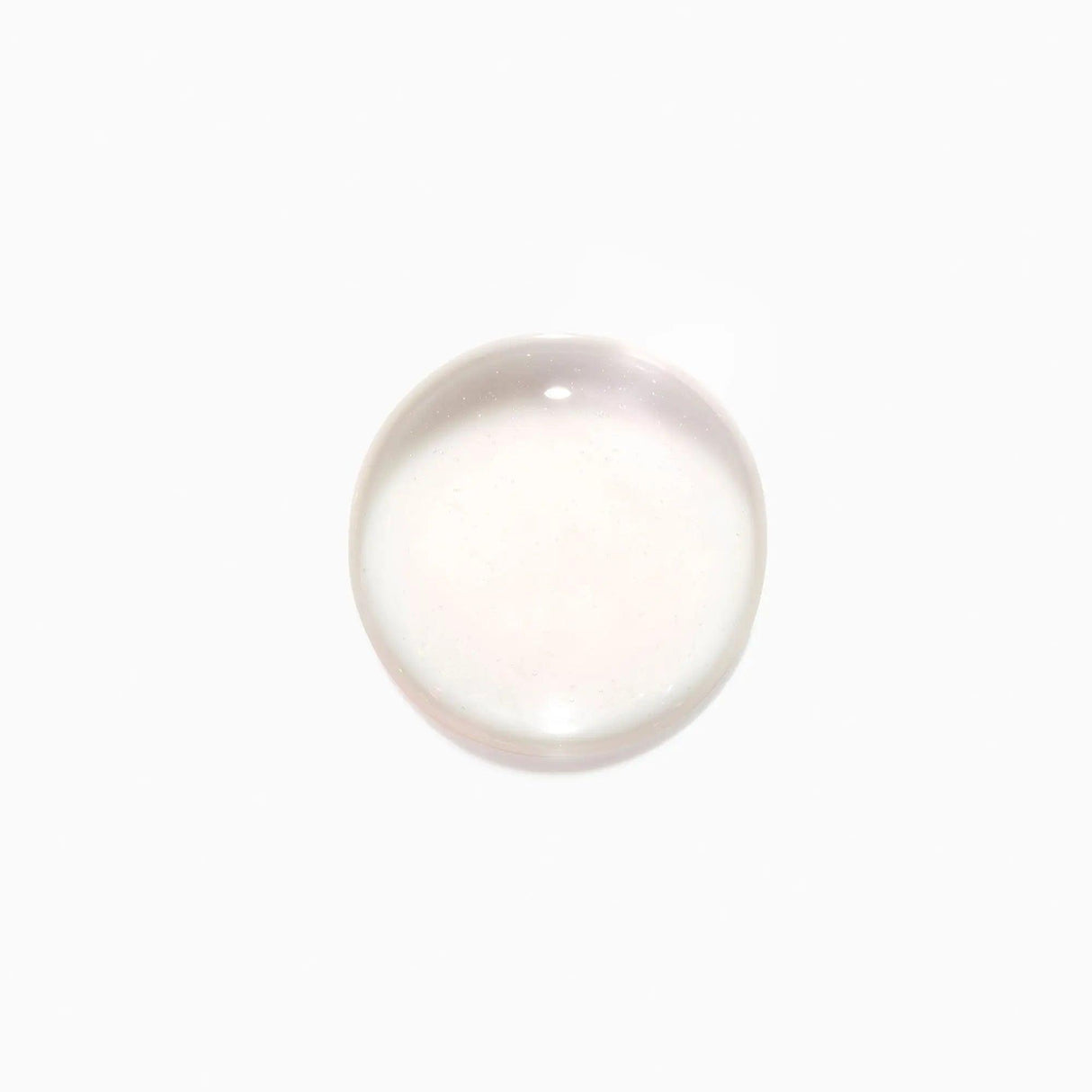 Clear drop of Initialiste serum for scalp health and hair growth