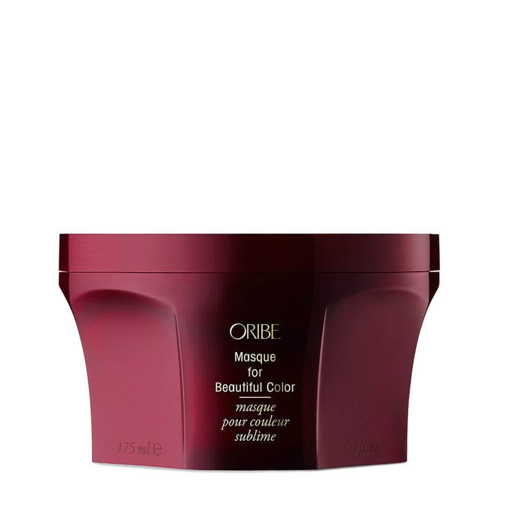 Oribe Masque for Beautiful Color, a color-enhancing hair repair treatment with UV protection, in a sleek maroon container.