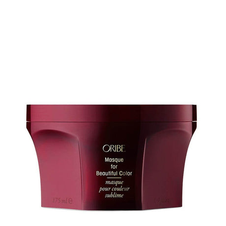 Oribe Masque for Beautiful Color, a color-enhancing hair repair treatment with UV protection, in a sleek maroon container.