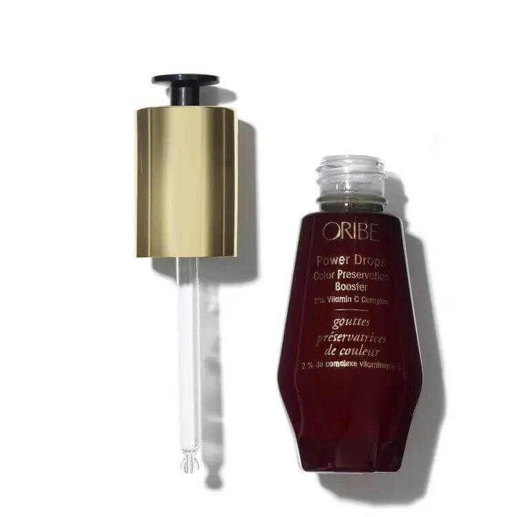 Power Drops Color Preservation Booster serum bottle with dropper, enhances hair color protection and longevity with antioxidants.
